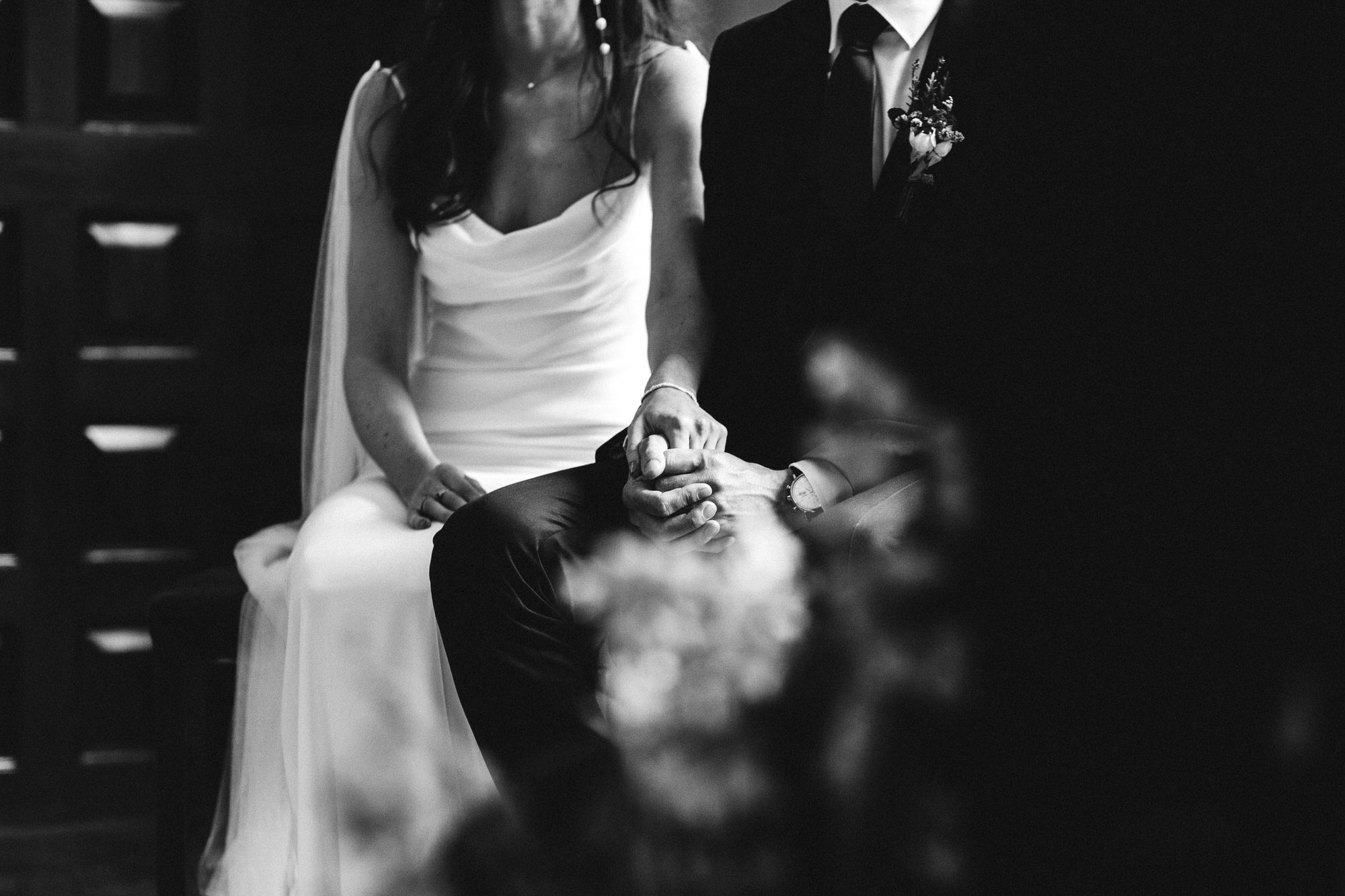 couple hold hands during their ceremony