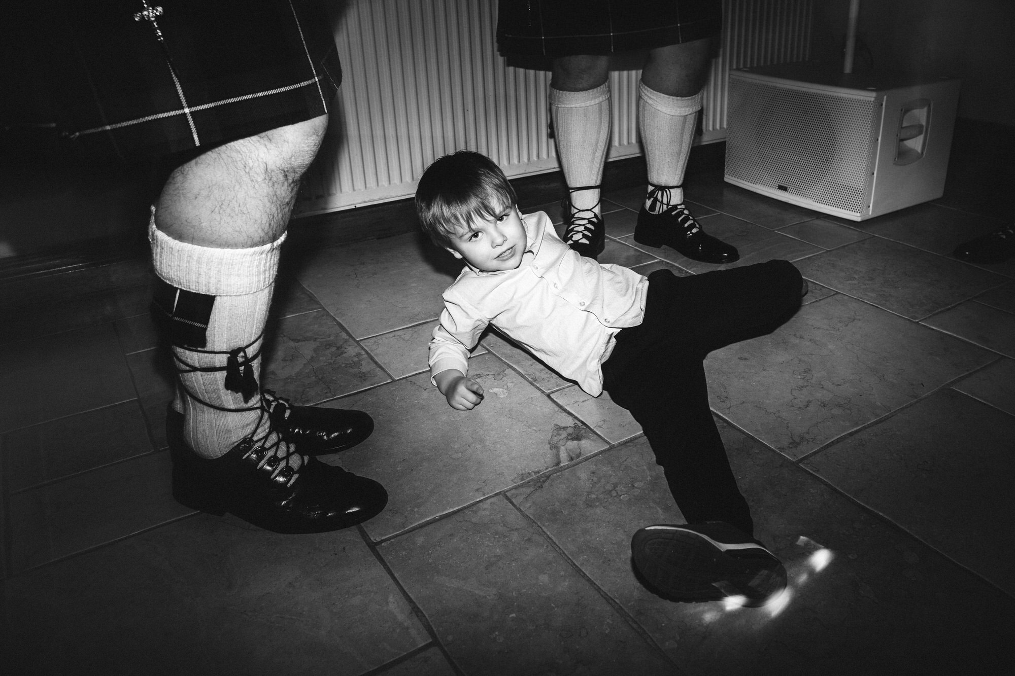 child on floor doing break dancing