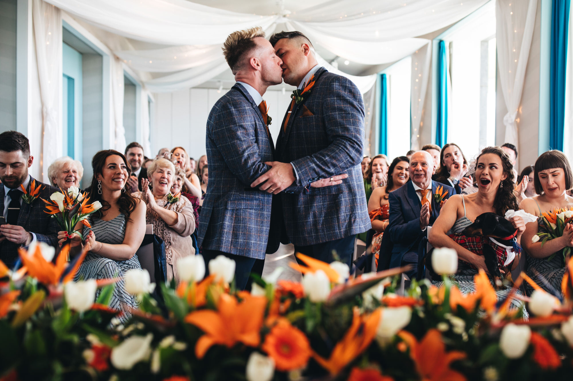 grooms have first kiss