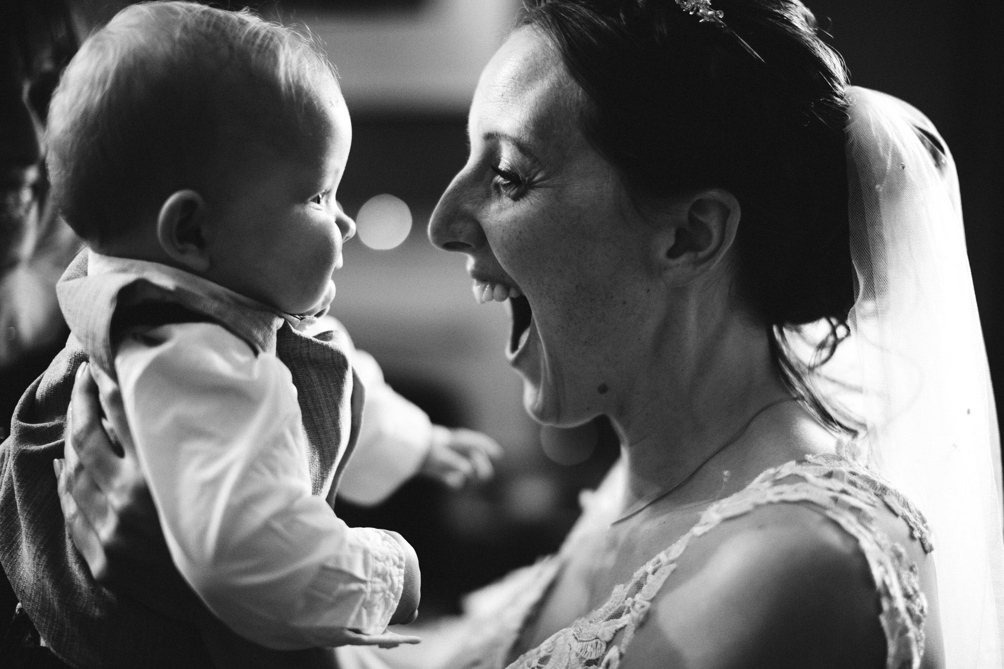 bride smiles at baby