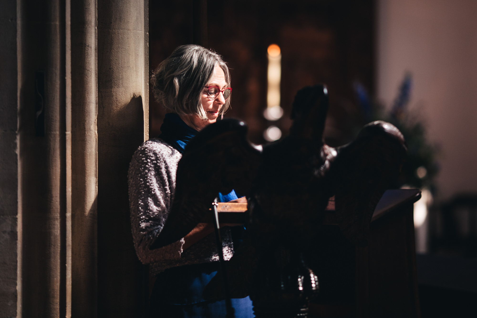 beautiful light streams in to the church on a guest doing a reading