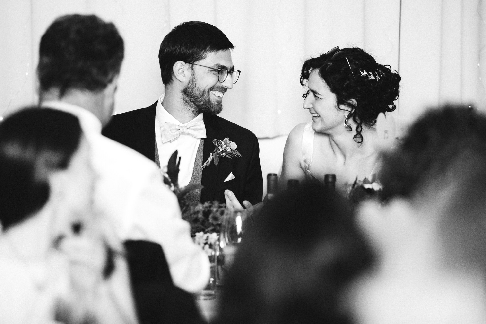 couple look at each other during speeches