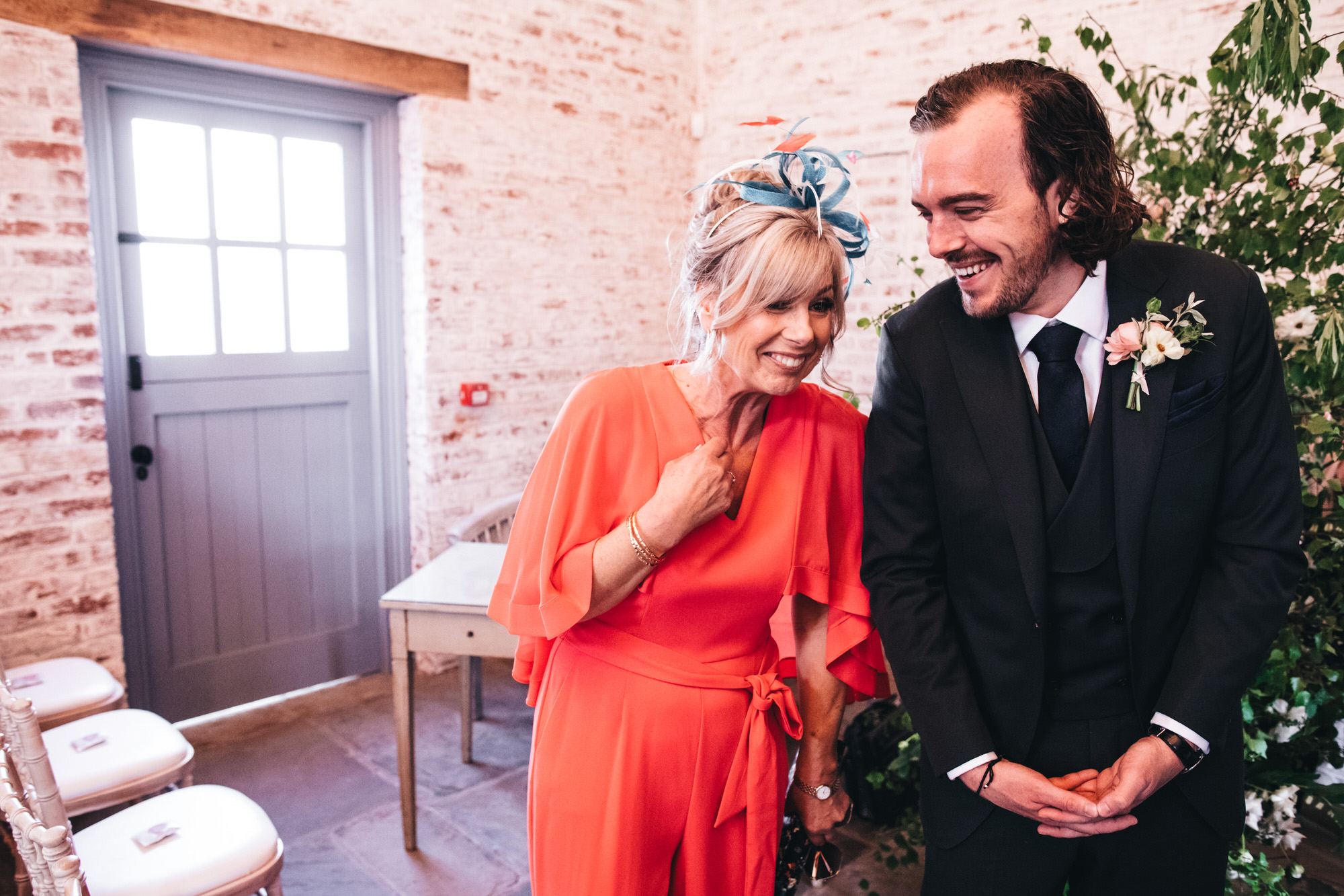 groom laughs with his mum