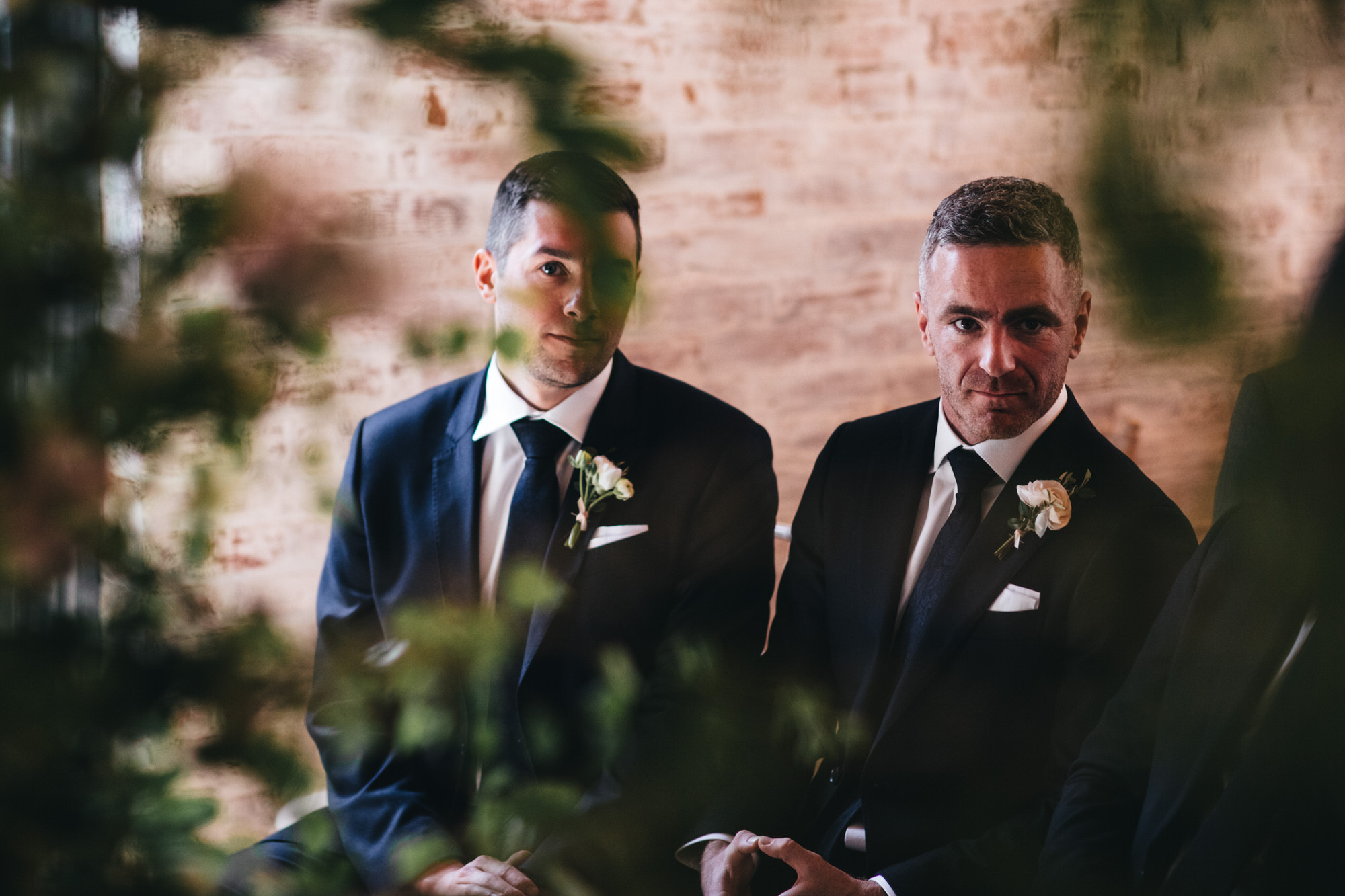groomsmen at front of wedding ceremony