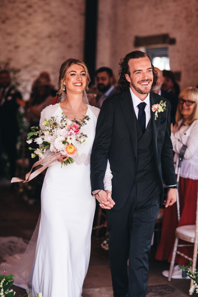 couple leave coach house married