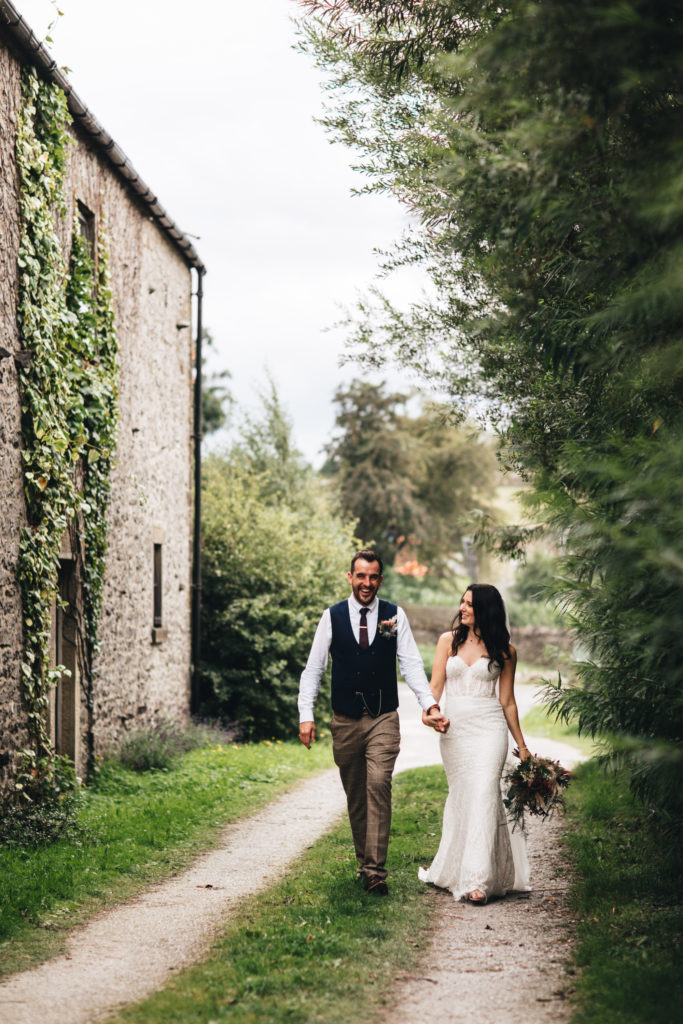 newly married couple go for romantic walk together