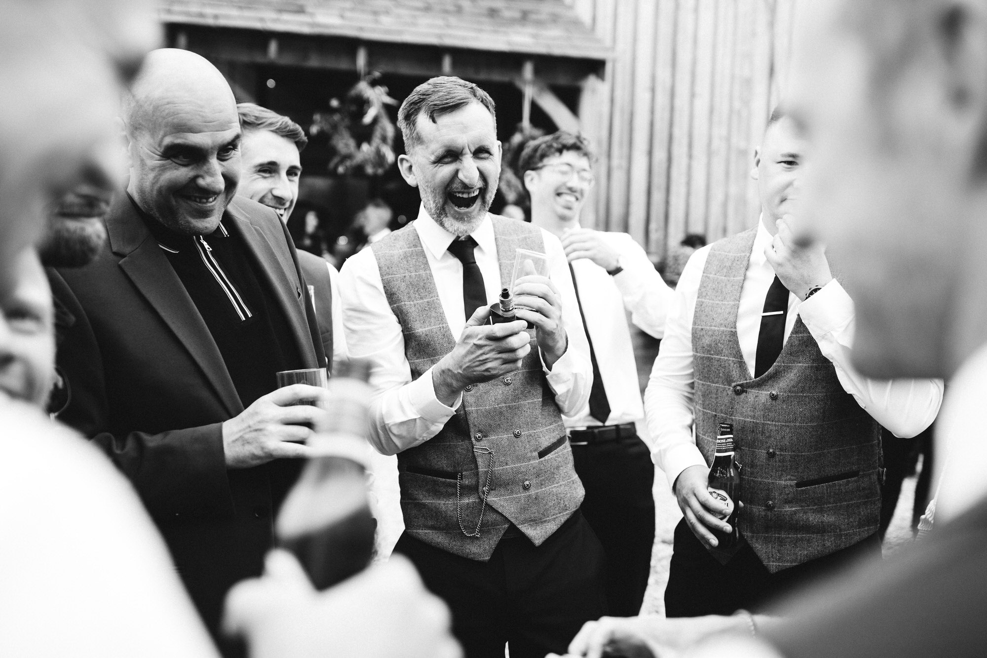 candid shot of wedding guest laughing