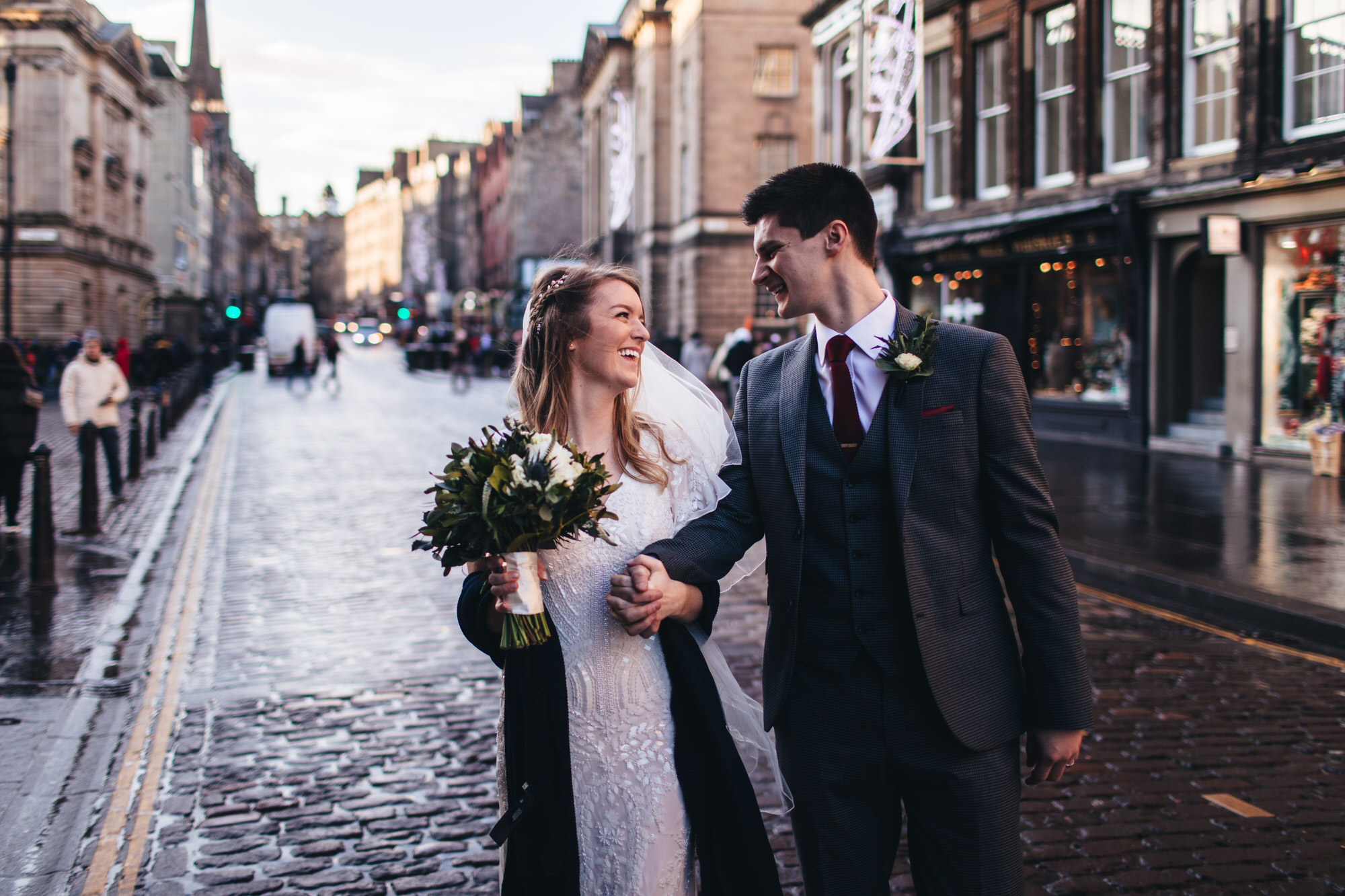 couple in road on royal mile