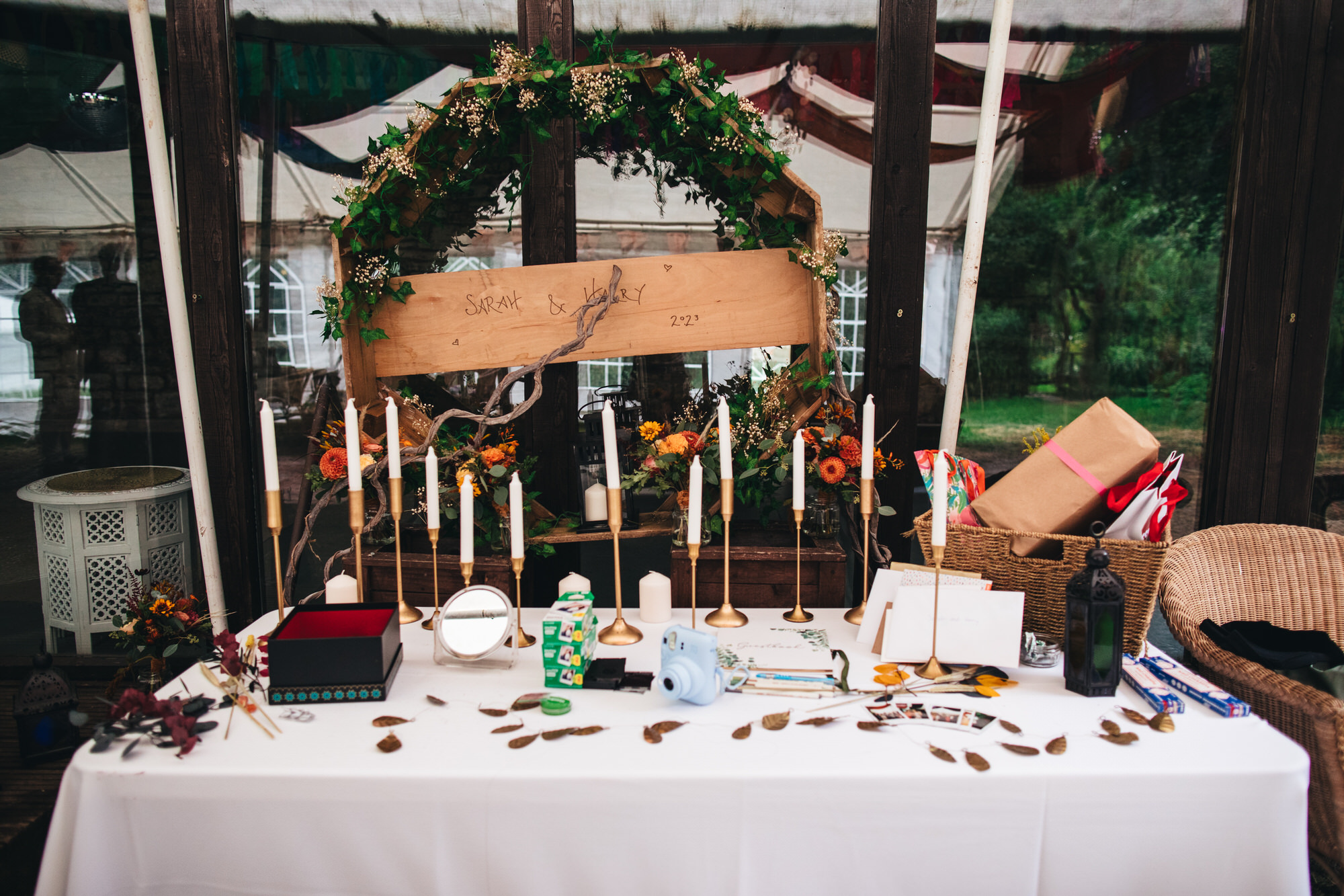 wedding ideas, table with gifts, cards, instax instant camera and film, candles
