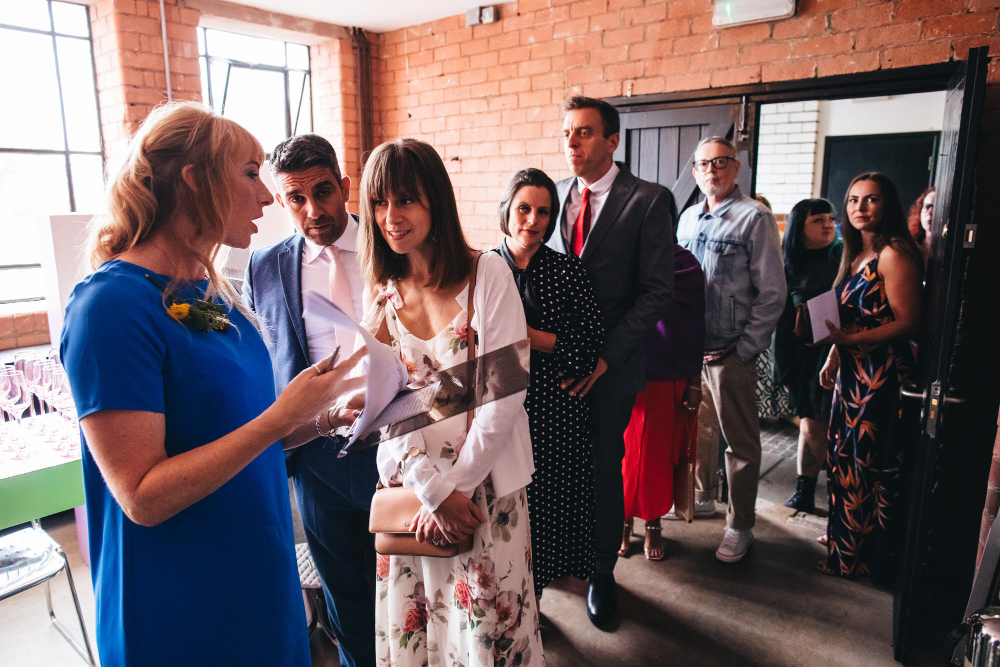 bridesmaids and ushers talking with guests