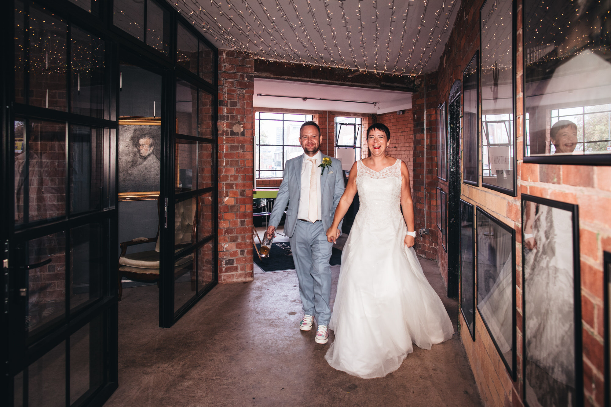 bride and groom enter venue together, announced into room