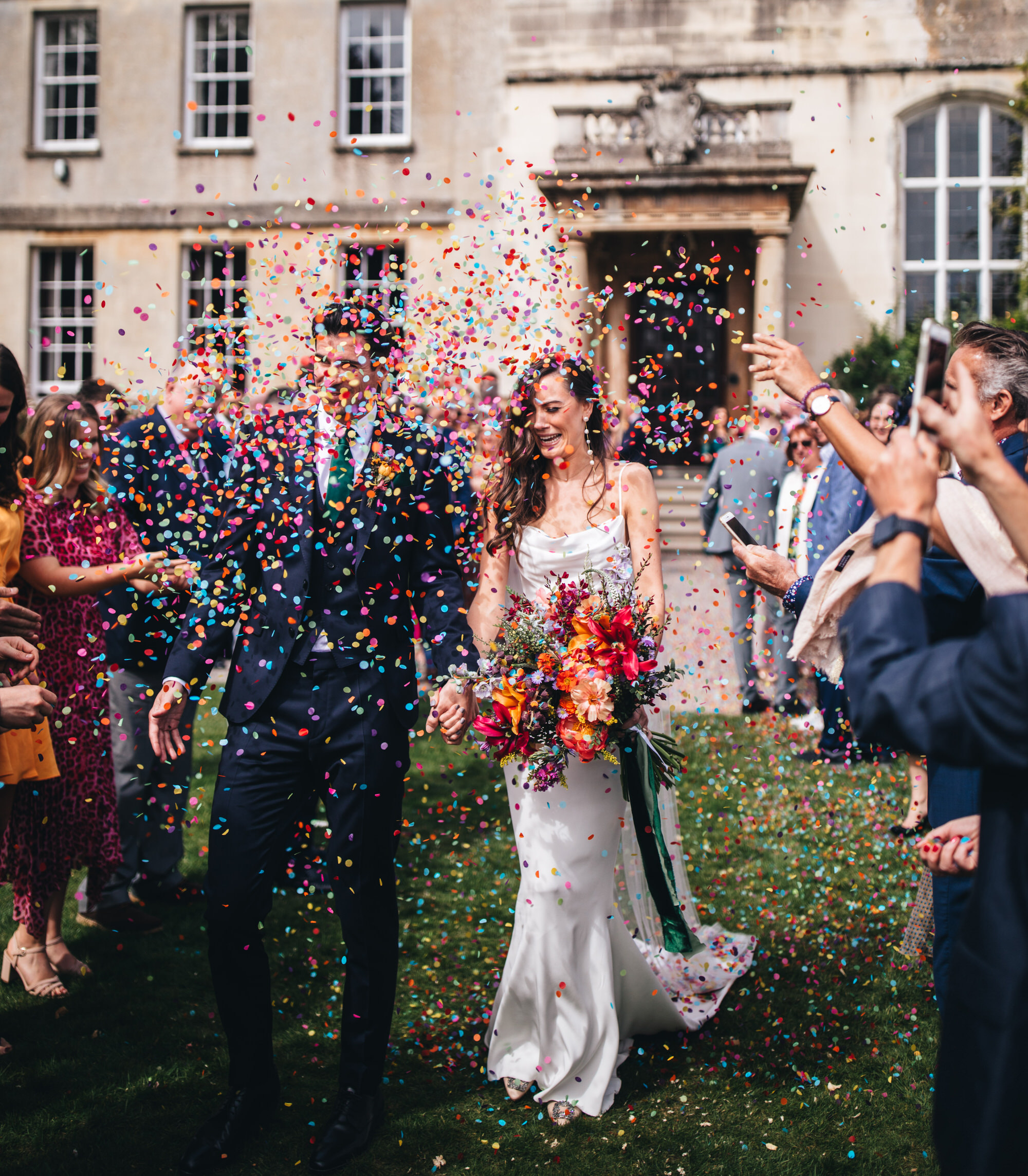 confetti shot with bride and groom outside Elmore Hall, Elmore Court wedding photography