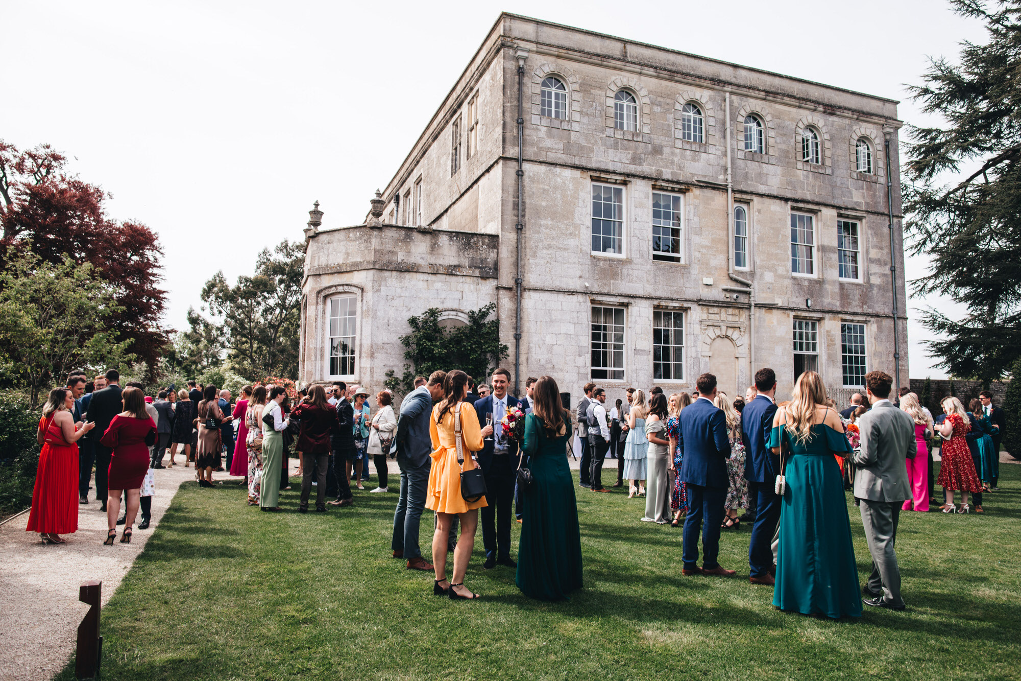 guests gather on lawn outide Elmore Court