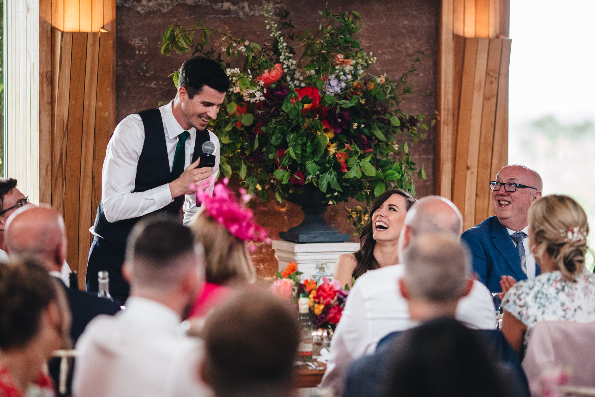 bride laughing at groom's speech