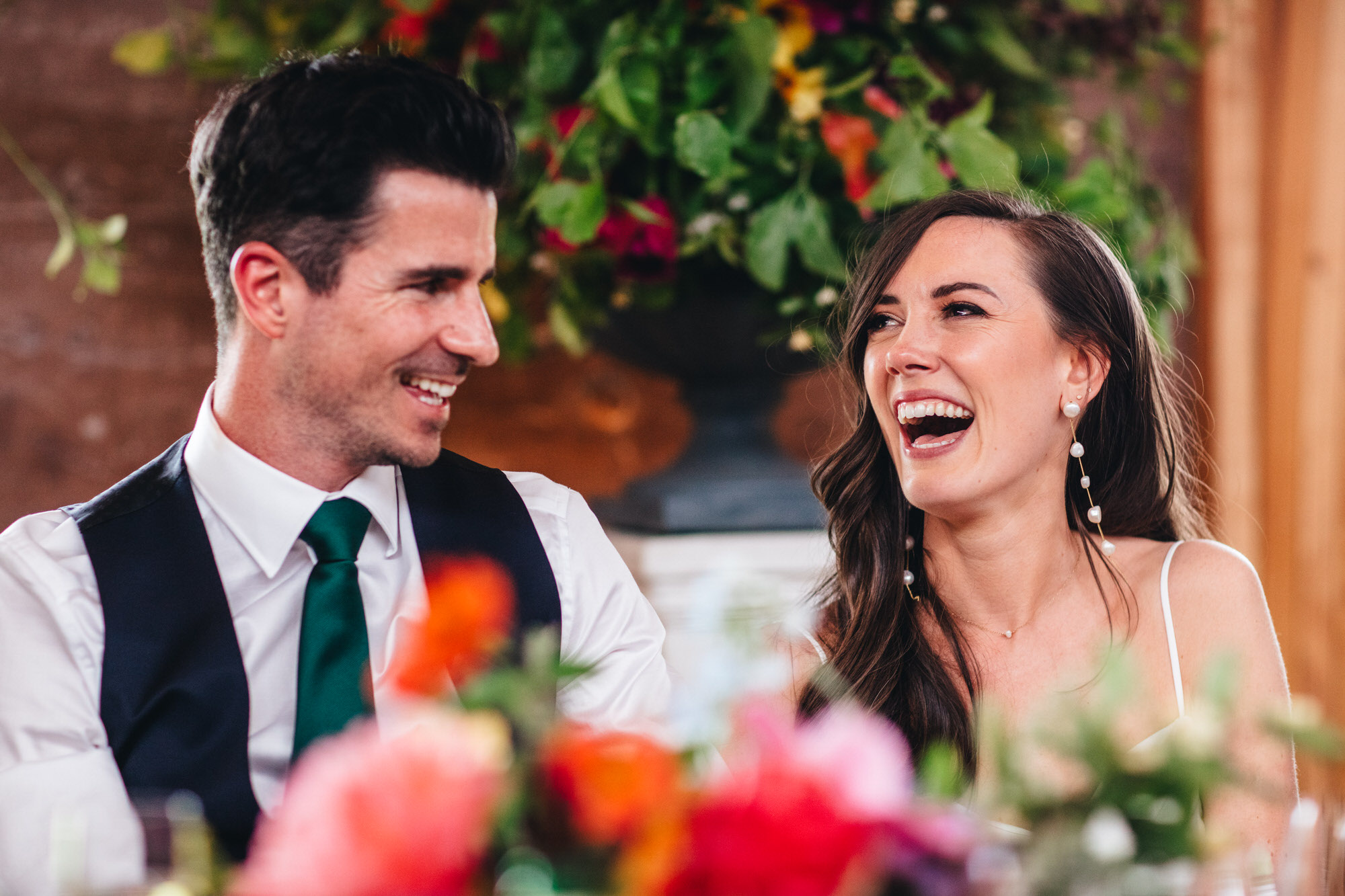 bride laughing next to groom