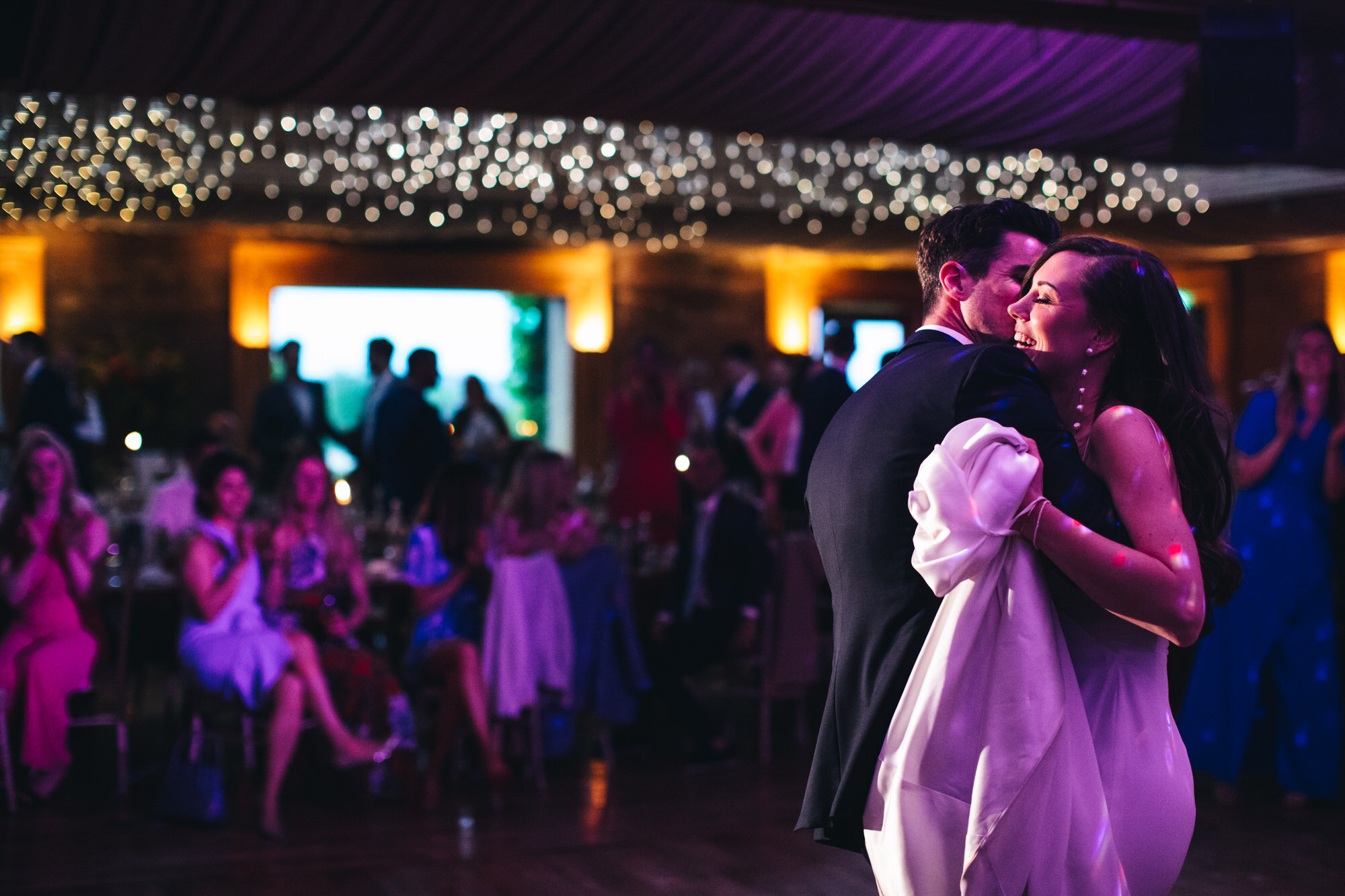 bride and groom hug, embrace at first dance, wedding photography at The Gillyflower, Elmore Court