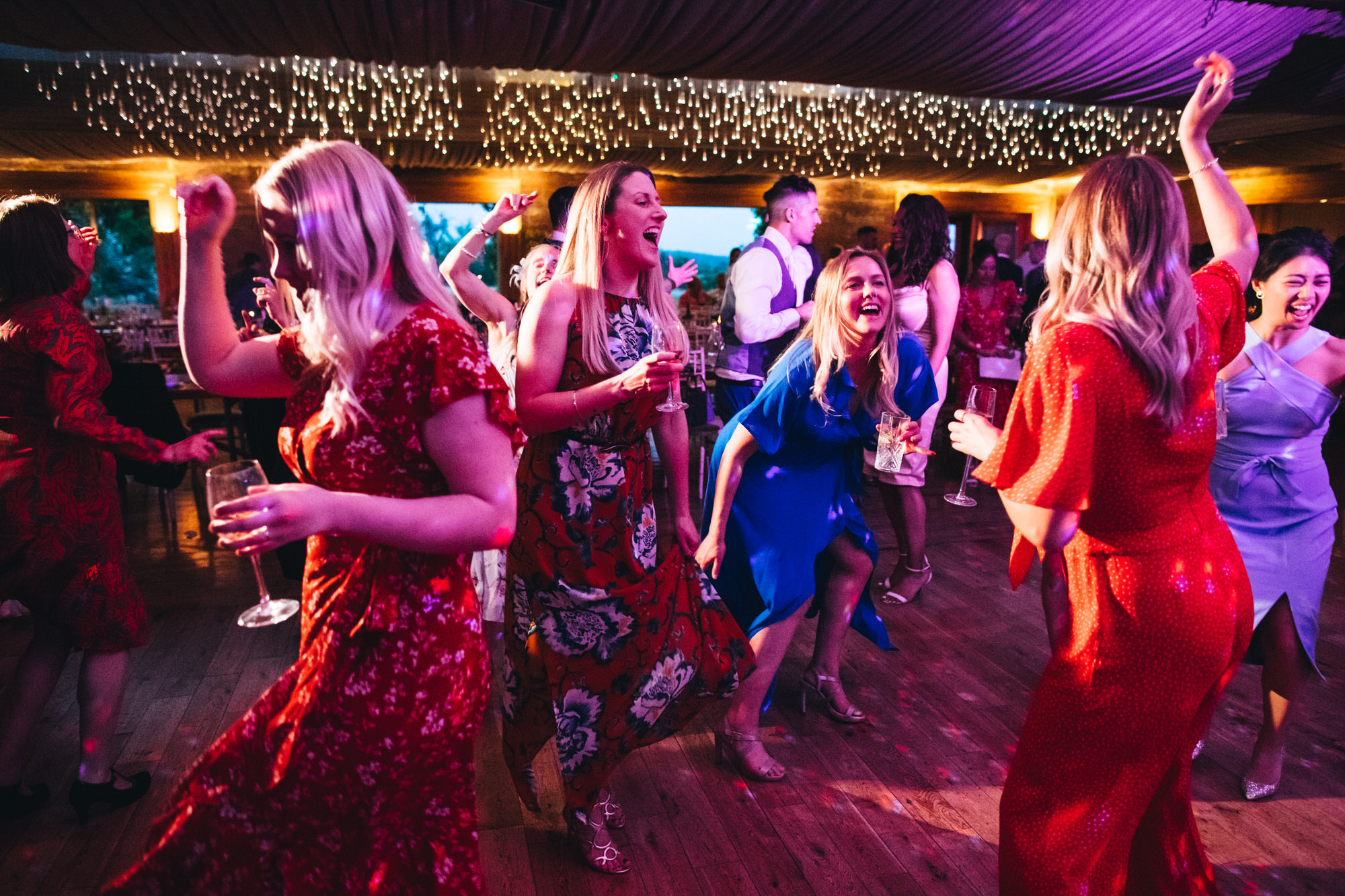 wedding guests women dancing on dancefloor at The Gillyflower, Elmore Court