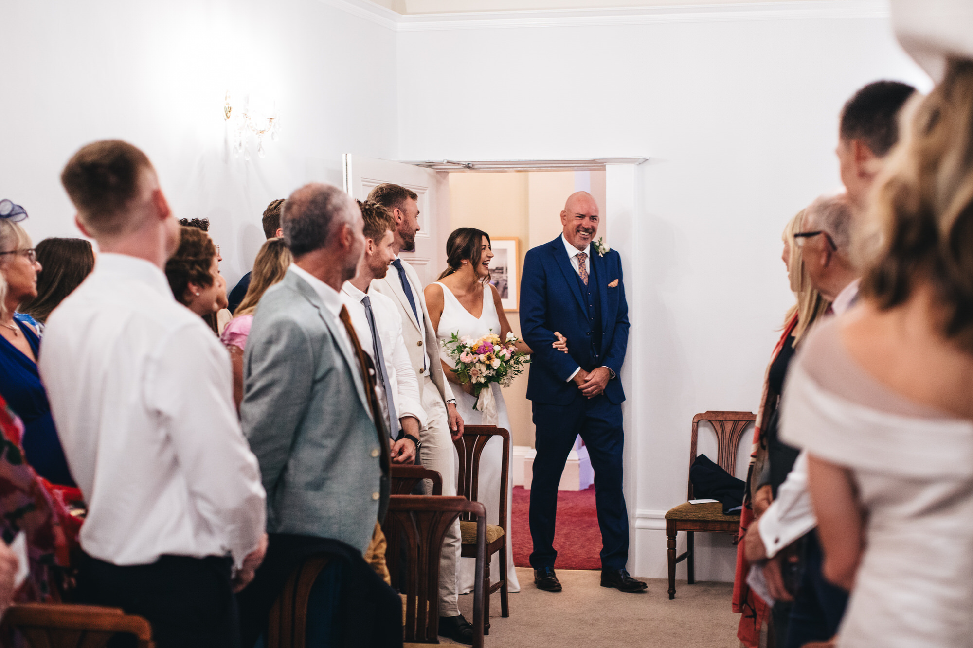 bride and father entering ceremony to walk down aisle