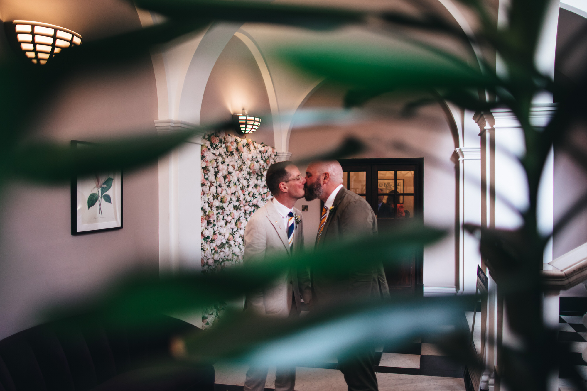 grooms kiss at Chelsea wedding, gay wedding