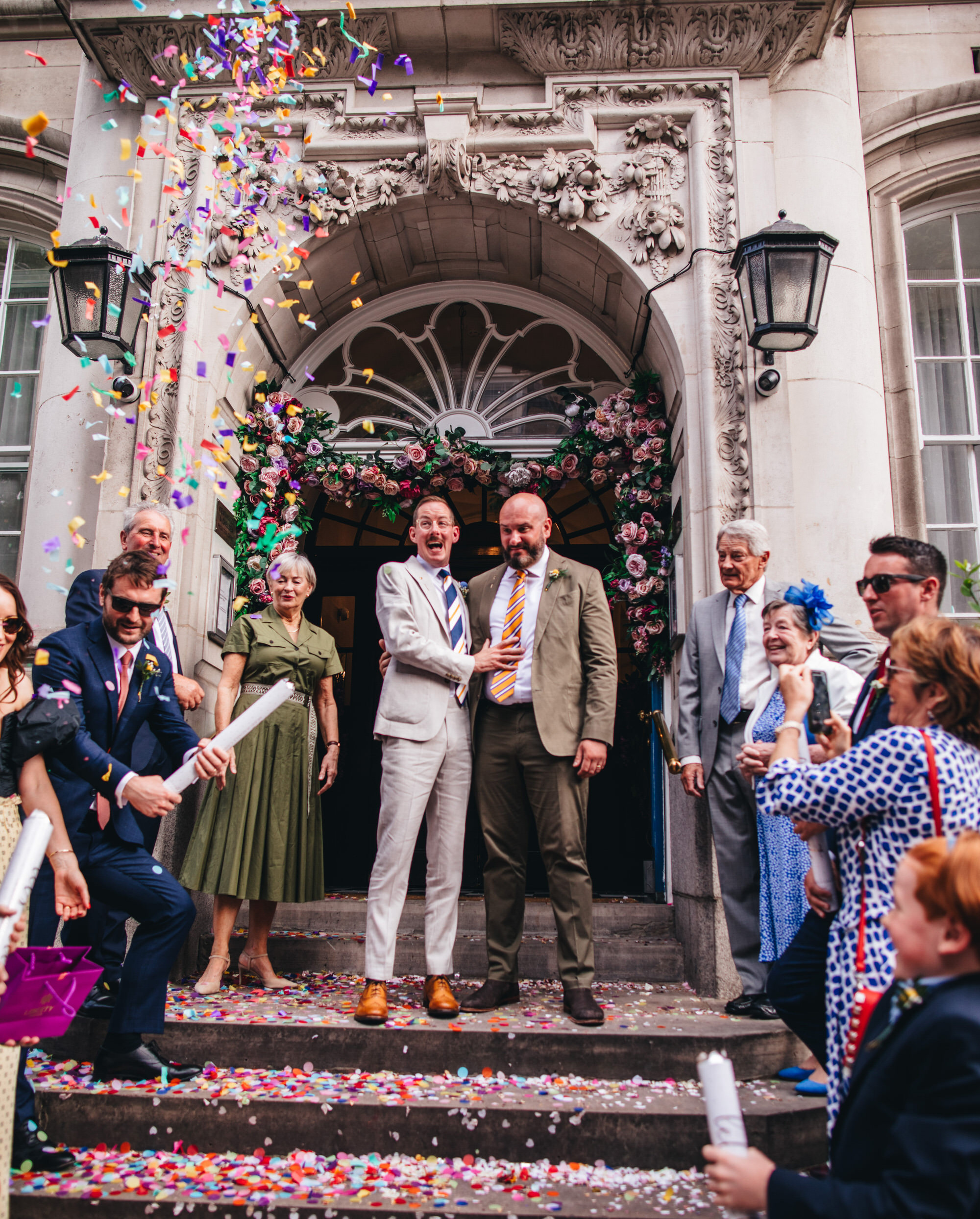 grooms outside Chelsea Old Town Hall wedding and confetti, LGBTQ+ wedding