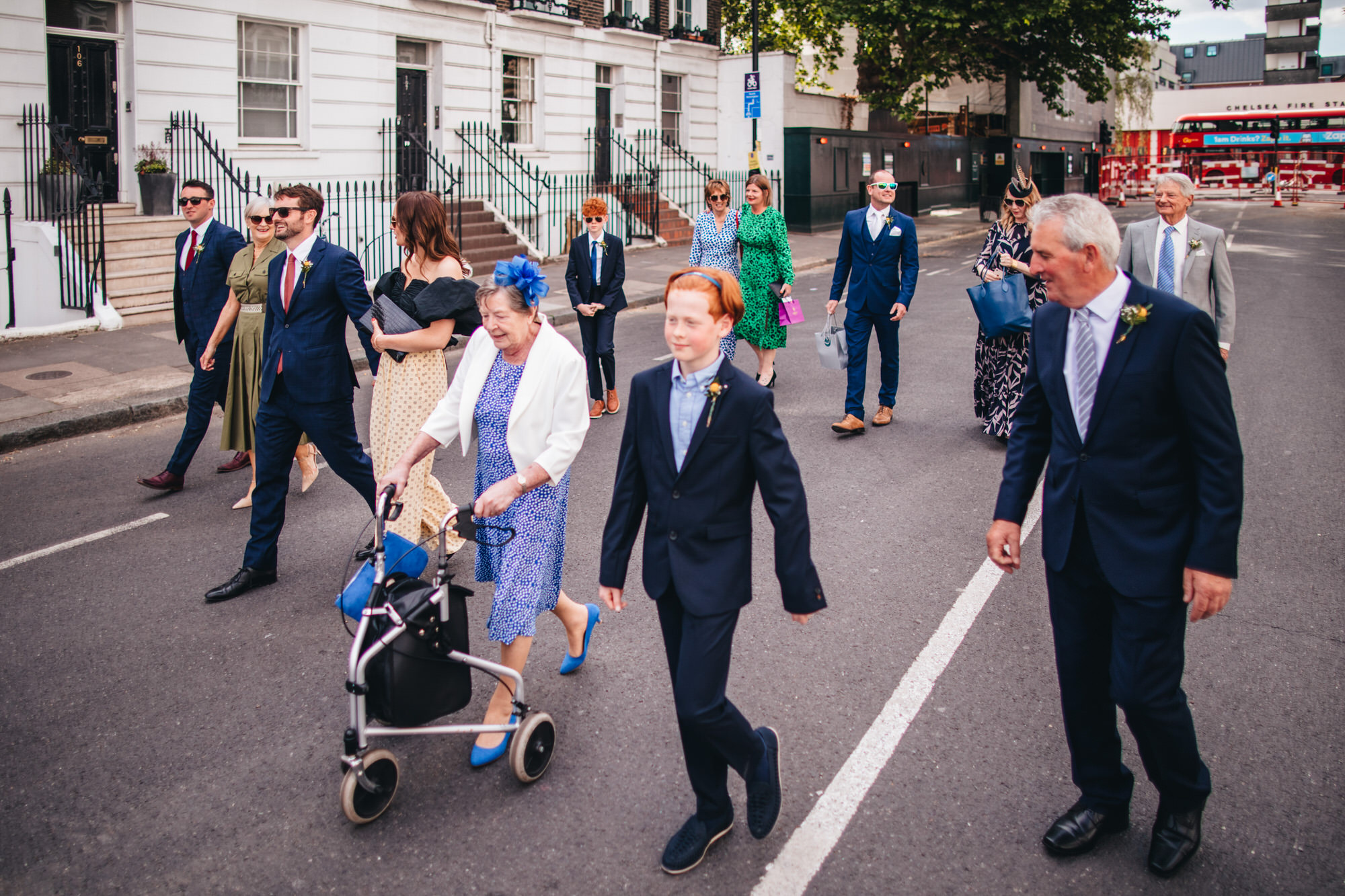 guests walking down street at London wedding, Chelsea wedding