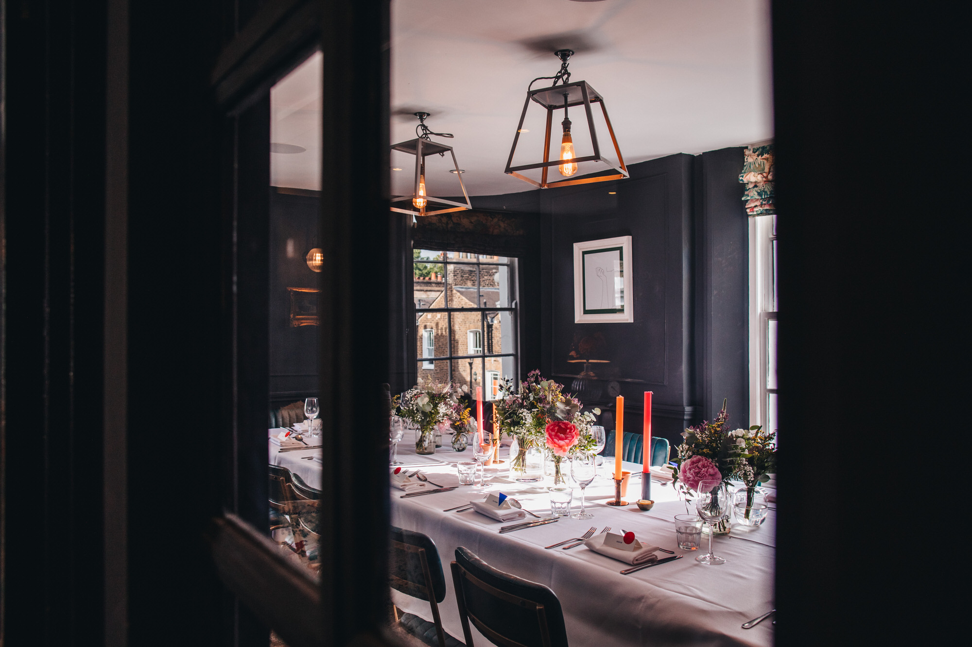 interiors wedding breakfast at The Phene, bouquets and candles, Chelsea pub wedding